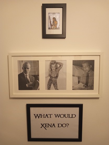 Three picture frames on a wall. The top black frame holds a trading card with Xena, Warrior Princess on it. The white frame below holds portraits of Hans Werner Henze, Britney Spears and Billy Strayhorn. The black frame on the bottom shows the question 
