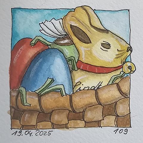 Aquarell: Osternest im geflochtenen Korb mit einem Lindt-Goldhäschen, zwei gefärbten Eiern und einem Schokoladenbonbon