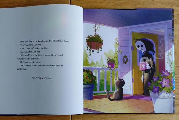 foto einer seite aus dem buch "the skeleton and the cat" von brandon james scott