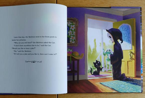 foto einer seite aus dem buch "the skeleton and the cat" von brandon james scott